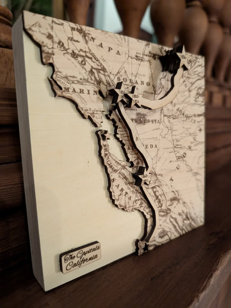 Laser cut wooden map showing California's historical capitals